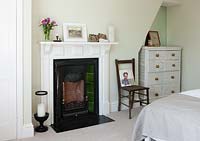 Period fireplace in bedroom
