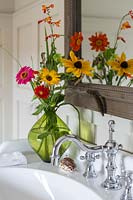 Vase of flowers by sink