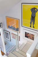 Contemporary staircase with colourful art display