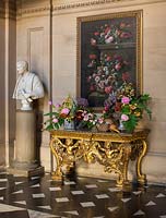 Gilded table with floral display and 'Still life in flowers'  painting by Jean-baptiste Monnoyer 