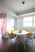 Dining area with colourful chairs