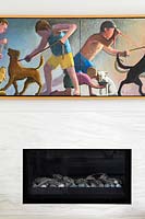Modern painting above fireplace