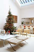 Open plan living space decorated for christmas