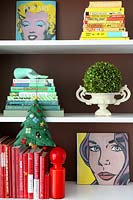 Colourful bookshelves with christmas tree decoration