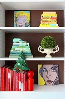 Colourful bookshelves with christmas tree decoration