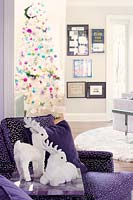 Reindeer toys on purple armchair
