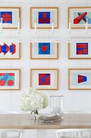 Colourful art display on dining room wall