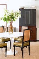 Classic chairs at modern dining table