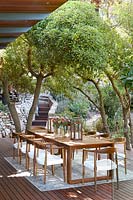 Outdoor dining area beneath trees