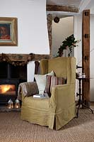 Classic armchair by fire