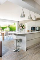 Contemporary open plan kitchen diner with breakfast bar