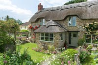 Thatched cottage and garden in summer