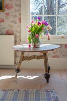 Vase of Tulips on vintage table
