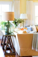 Glass lamp on console table