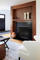 Modern fireplace with wooden surround