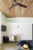 Wooden desk in bedroom corner