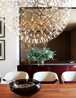 Spherical light above dining table
