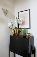 Orchid in gold pot