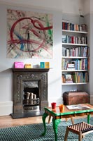 Abstract art above period fireplace