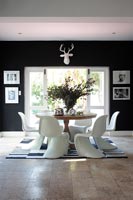 Designer chairs around dining table