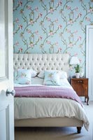 Patterned wallpaper in bedroom