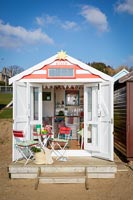Beach hut with table and chairs