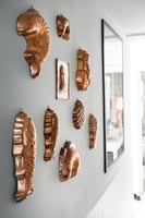 Detail of wall mounted copper moulds