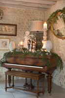 Classic wooden piano decorated for Christmas