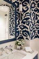 Detail of blue and white wallpaper in the bathroom
