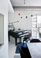 Small grand piano in modern apartment