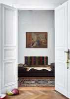 View through door to sofa and artwork 