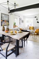 Wooden table and exposed metal beam