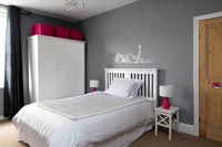 Childrens bedroom with storage and lamps
