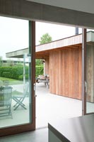 Sliding patio doors leading from kitchen to terrace 