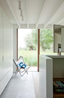 Folding butterfly chair by window in contemporary home 