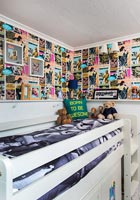 Bunk bed and feature wall of comics in childrens room 