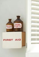 Vintage bottles and first aid box 