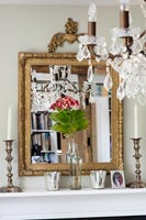 Classic gold framed mirror and chandelier 