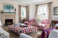 Modern colourful central upholstered table in country living room 