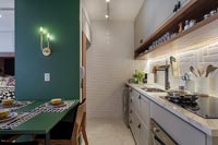 Green wooden frame with built in dining table in kitchen