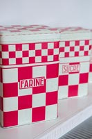 Vintage red and white kitchen storage tins 