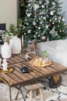 Large coffee table and Christmas tree in modern living room 