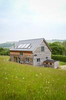 Wooden house on hillside with countryside views 
