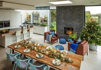 Modern kitchen and dining room decorated for Christmas