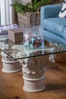 Glass top coffee table with stone pedestals 