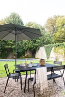Outdoor dining area, lawn and swimming pool 