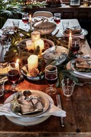 Country dining table laid for Christmas dinner 
