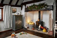 Large fireplace in childrens room decorated for Christmas 