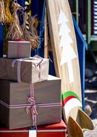 Close up of Christmas decorations and decorated surf board  