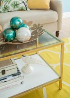 Decorative baubles on coffee table in colourful living room 